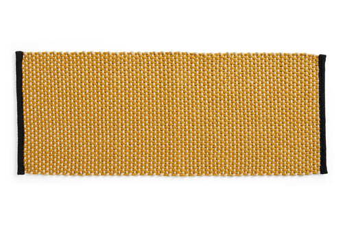HAY long ochre door mat rug with textured surface, ideal for indoor or outdoor entryways.